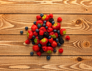 Naklejka na ściany i meble Berries on Wooden Background.