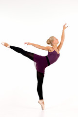 Fototapeta premium Young blonde ballerina in Arabesque