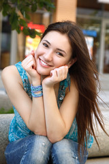 Outdoors portrait of beautiful young brunette girl