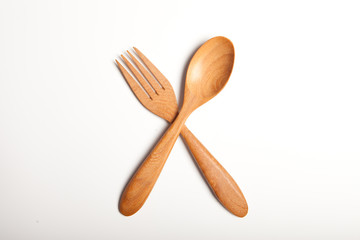 wooden fork and spoon crossing 