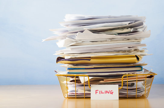 Filing Tray Piled High With Documents