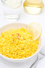 rice with lemon and saffron in the bowl, vertical