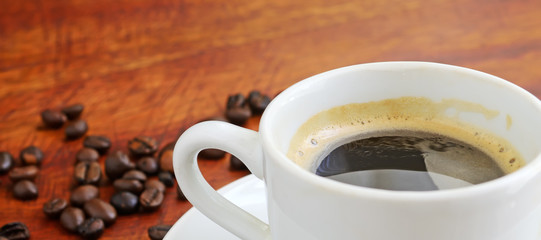 cup of coffee with beans