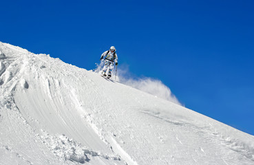 Naklejka na ściany i meble Skier on a background of clear sky