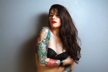 beautiful sexy tattooed woman with stylish make-up,