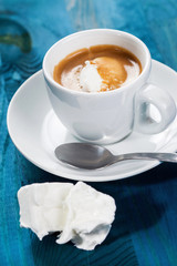 Cold, ice coffee on blue background
