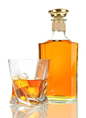 Glass of whiskey with bottle, isolated on white