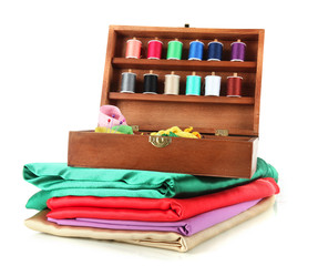 Naklejka premium Sewing kit in wooden box and cloth isolated on white