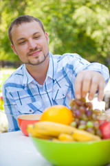 Man Enjoying Meal In Garden