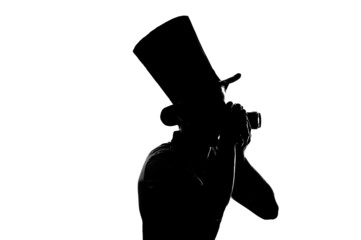 silhouette of a Young photographer with camera