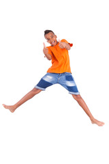 Fototapeta na wymiar Portrait of a cute teenage black boy jumping over white backgrou
