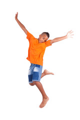 Portrait of a cute teenage black boy jumping over white backgrou