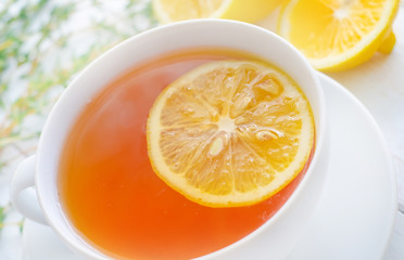Fresh tea with lemon in the white cup