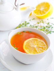 Fresh tea with lemon in the white cup