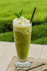 ice Green tea with a straw isolated on white background