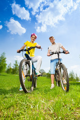 Naklejka premium Man and woman on bikes