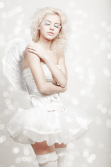 young blond woman in angel costume