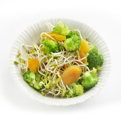 fresh healthy radish sprout salad with apricot and broccoli