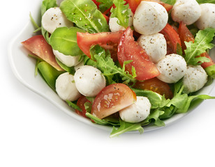 healthy fresh rucola salad with mozarella and tomato slices