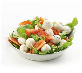 healthy fresh rucola salad with mozarella and tomato slices