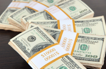 Stacks of money on wooden table