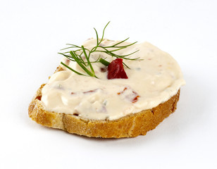 spread cheese with red pepper and dill on bread