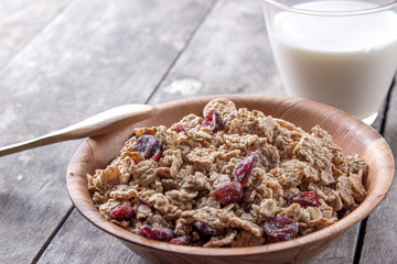 A bowl of cereal with cranberries