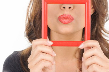 Lips in picture frame. Close-up of female lips in picture frame