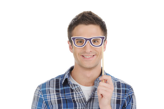 Man in party glasses. Handsome young man in party glasses lookin