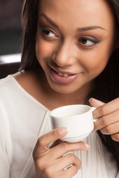 Beauty drinking coffee. Portrait of beautiful African descent wo