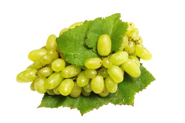 green grapes with leaves. Isolated on white