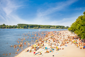 People on the public beach Oficirac on Danube river, Novi Sad, S