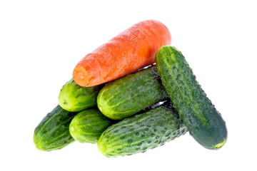 ripe cucumbers and carrots on a white background