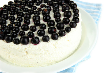Cheesecake with fresh berries on white plate closeup