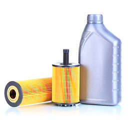 Car oil filters and motor oil can isolated on white