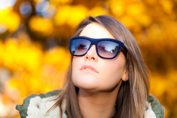 Cute girl in an autumnal environment