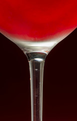Wineglass with cold red wine