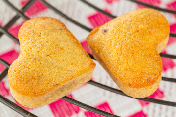 Ywo Homemade heart shaped banana muffins cooling on metal rack