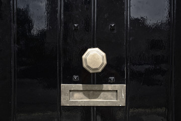 black door with mail slot