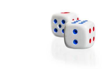 two white dice stand  on a white background