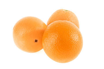 Several fresh oranges isolated on a white background.