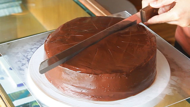 Cutting chocolate cake