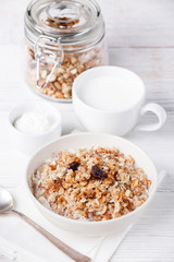 Muesli granola with raisin in wooden bowl
