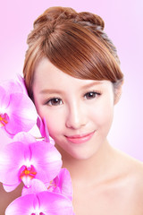 woman smile face with orchid flowers