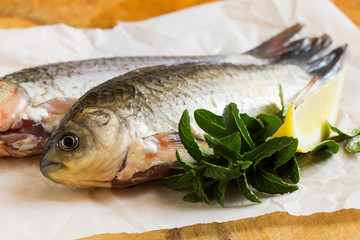 Fresh raw fish on wooden table