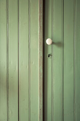 Fototapeta premium Old green door with white door handle
