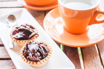 Hot tea and crispy chocolate tarts