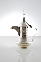 An ornate dallah which is a metal pot for making Arabic coffee