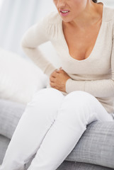 Obraz na płótnie Canvas Closeup on young woman having stomach pain