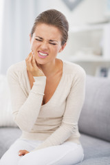 Young woman having toothache